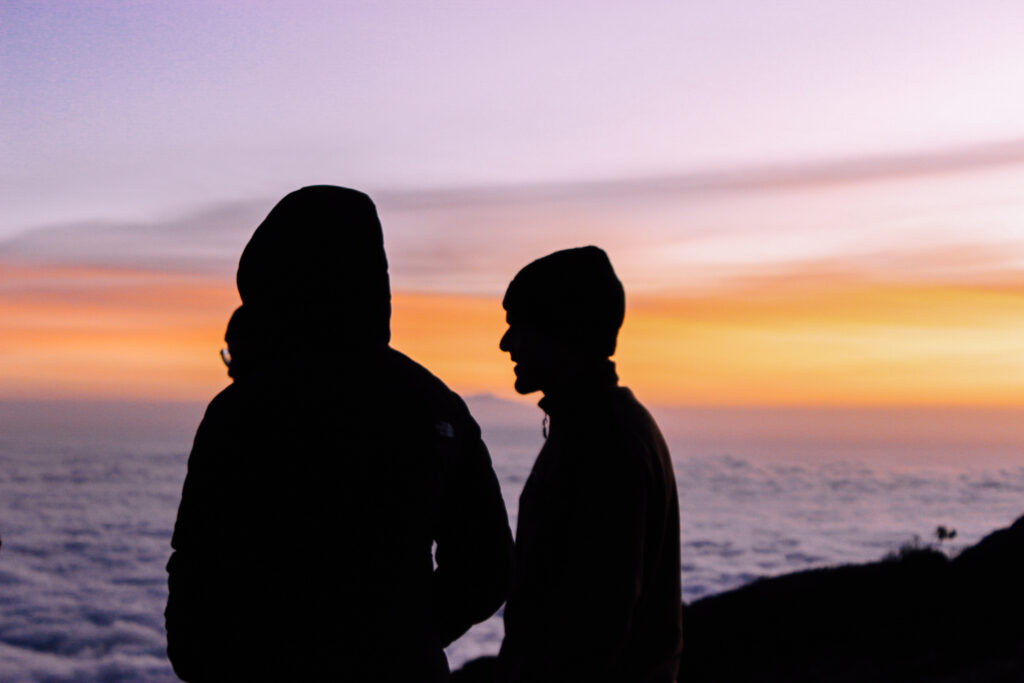 Life Happens Outdoors team enjoying sunset together at Karanga Camp on the Machame route.